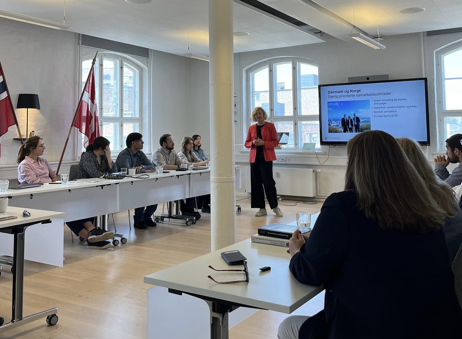 NCLOS staffers paying attention to a presentation at the embassy.