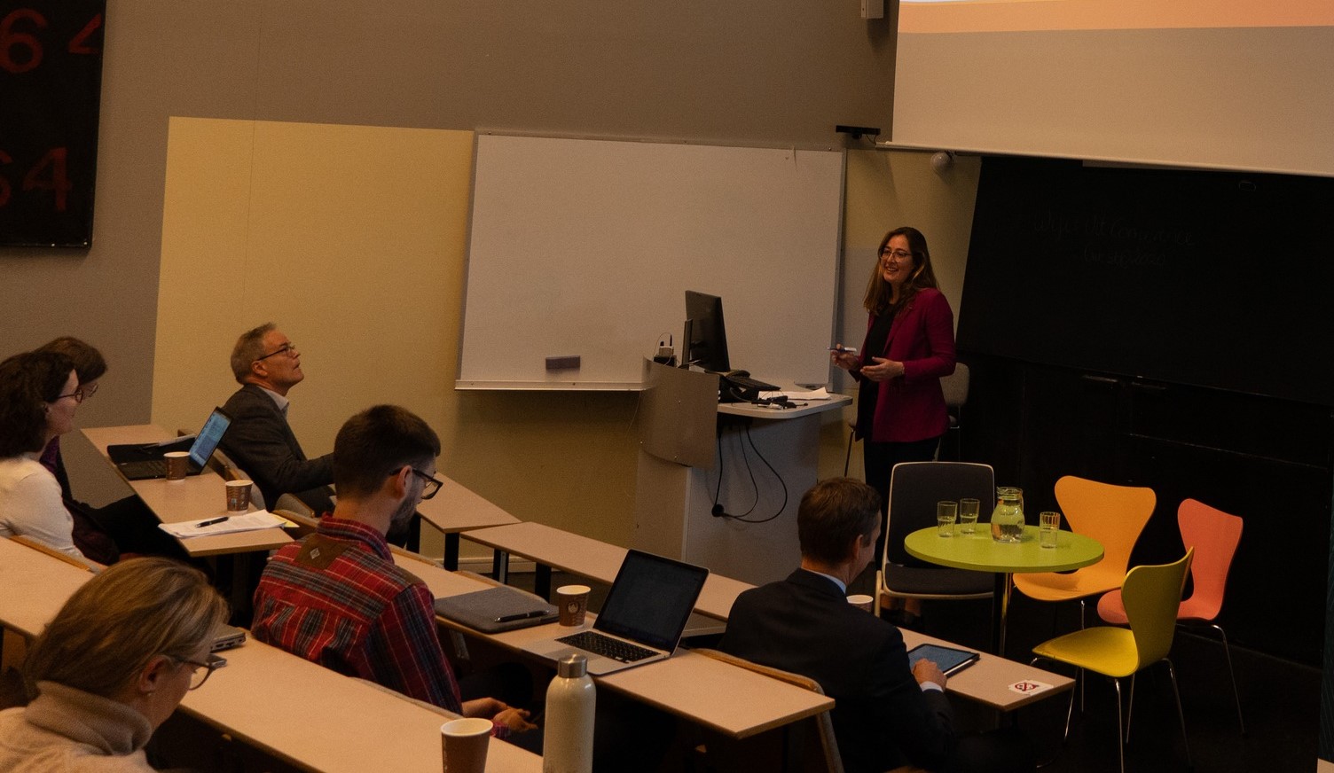 She is standing in front of an audience.