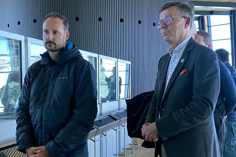 Two men standing beside each other.