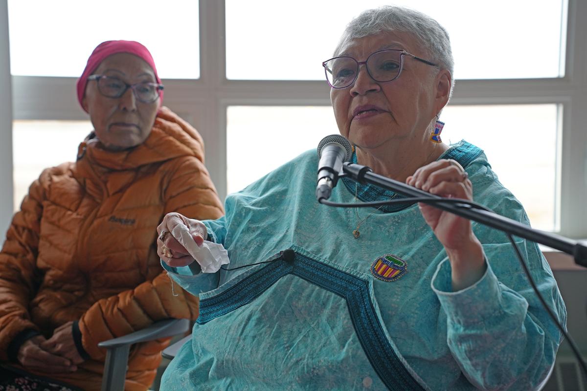 Two women sitting beside each other